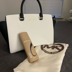 Brand new Michael Kors Purse w dust bag and cleaner